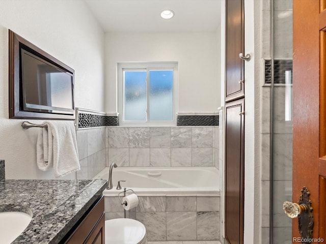 2535 Leyden St, Denver, CO 80207 - full bathroom featuring vanity, a garden tub, and toilet