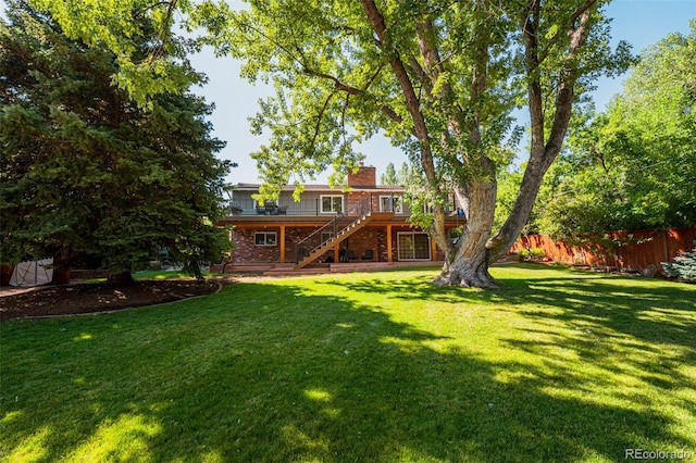 view of yard with a wooden deck