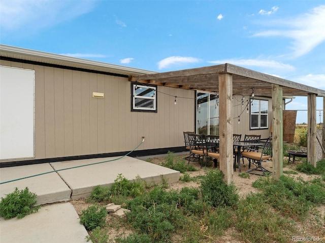 69501 E 72nd Ave, Byers, CO 80103 - rear view of house featuring a patio area and outdoor dining area