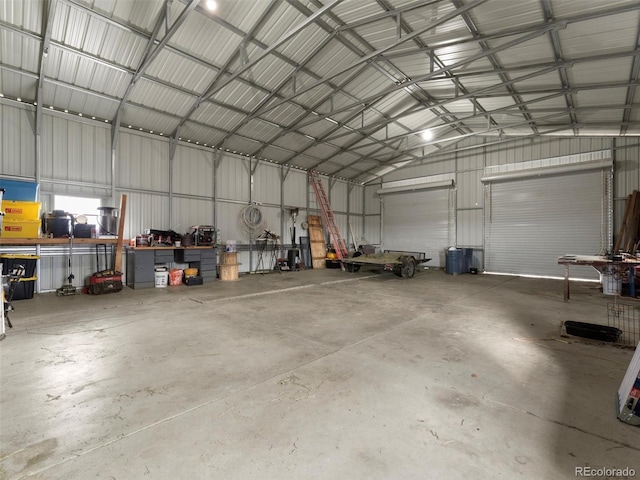 69501 E 72nd Ave, Byers, CO 80103 - garage with metal wall and a workshop area