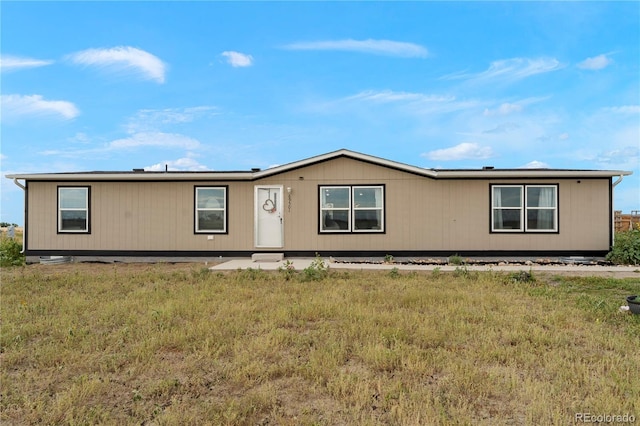 69501 E 72nd Ave, Byers, CO 80103 - manufactured / mobile home featuring a front lawn