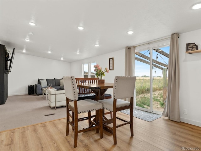 69501 E 72nd Ave, Byers, CO 80103 - dining space featuring light wood-type flooring and recessed lighting