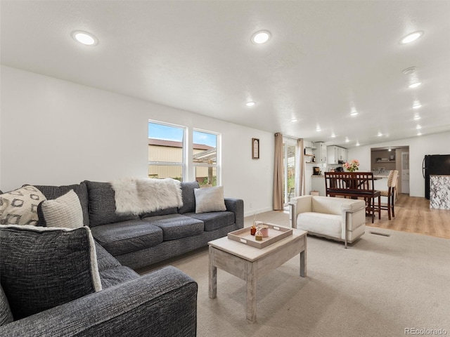 69501 E 72nd Ave, Byers, CO 80103 - living area with recessed lighting and light colored carpet