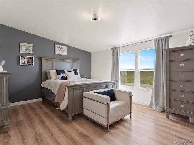 69501 E 72nd Ave, Byers, CO 80103 - bedroom featuring light wood finished floors and vaulted ceiling