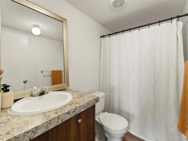69501 E 72nd Ave, Byers, CO 80103 - bathroom featuring vanity, crown molding, and a shower with shower curtain