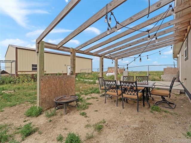 69501 E 72nd Ave, Byers, CO 80103 - view of patio featuring a pergola and outdoor dining space