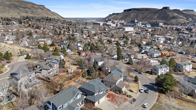 birds eye view of property featuring a residential view and a mountain view