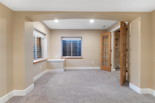 unfurnished room with carpet, baseboards, and recessed lighting