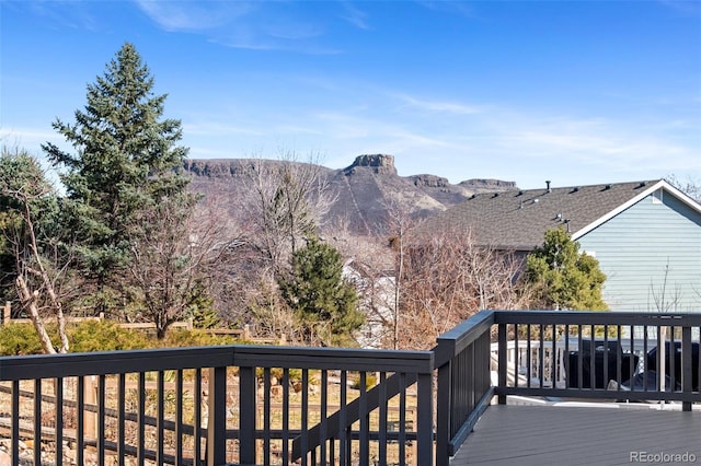 wooden deck featuring a mountain view