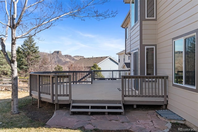 wooden deck with fence and a mountain view