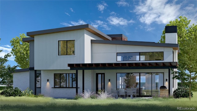 rear view of property featuring a patio area