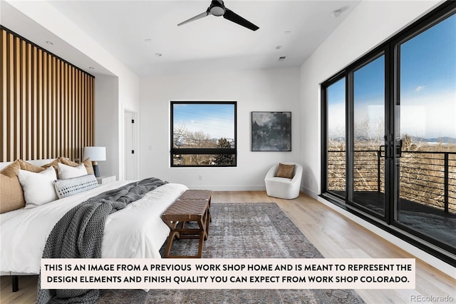 bedroom with hardwood / wood-style floors, multiple windows, and ceiling fan