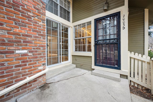 property entrance with brick siding