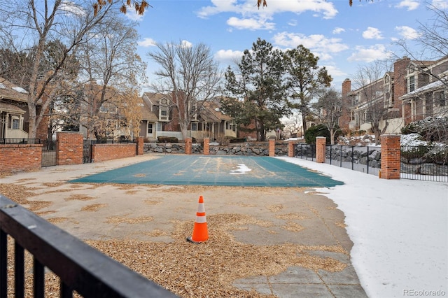 view of pool featuring a fenced in pool, a residential view, fence, and a patio