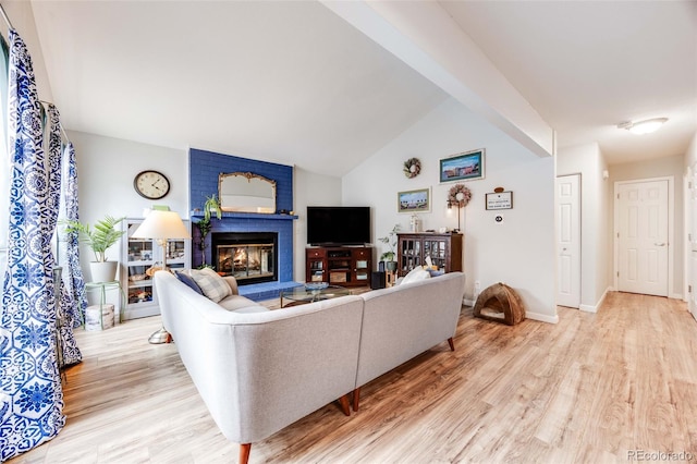 1236 Sequerra St, Broomfield, CO 80020 - living area with wood finished floors, a fireplace, and lofted ceiling