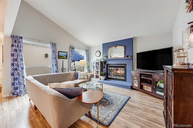 1236 Sequerra St, Broomfield, CO 80020 - living area with wood finished floors, a brick fireplace, and high vaulted ceiling