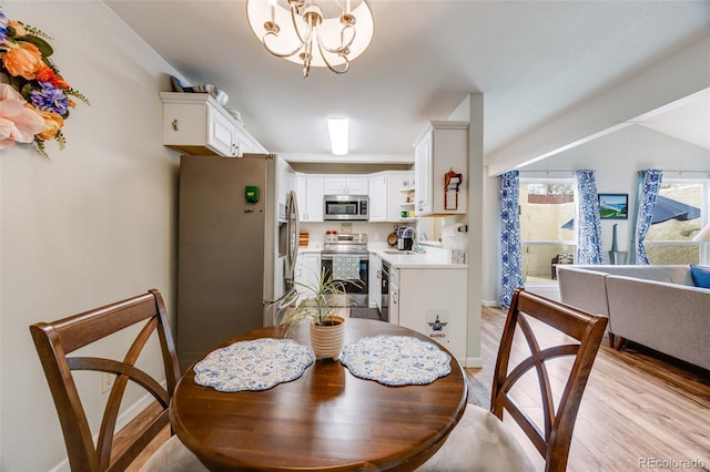 1236 Sequerra St, Broomfield, CO 80020 - dining room with light wood-type flooring and a chandelier