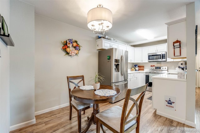 1236 Sequerra St, Broomfield, CO 80020 - dining room featuring light wood finished floors and a chandelier