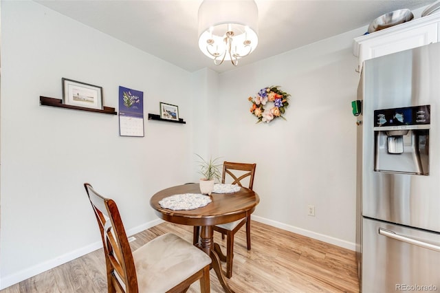 1236 Sequerra St, Broomfield, CO 80020 - dining area featuring light wood-style flooring and a chandelier