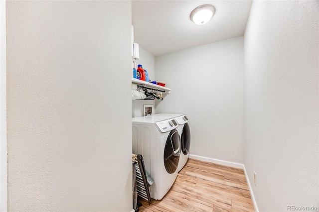 1236 Sequerra St, Broomfield, CO 80020 - washroom with washer and dryer and light wood-style flooring