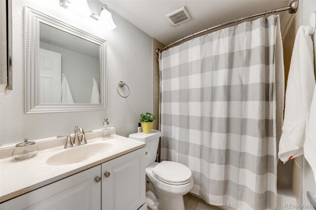1236 Sequerra St, Broomfield, CO 80020 - bathroom featuring vanity, a textured wall, and curtained shower