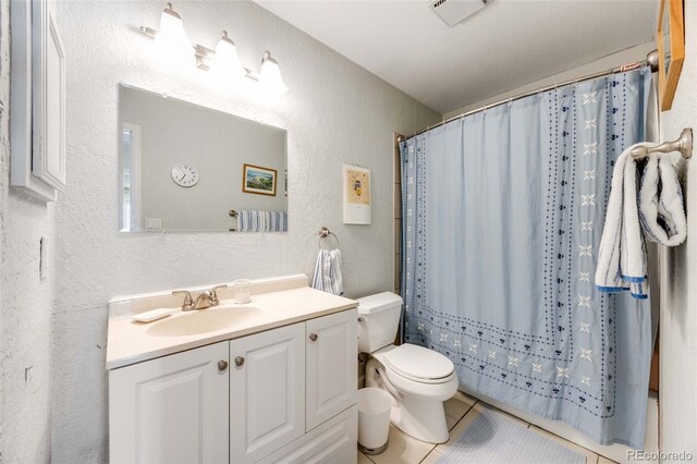 1236 Sequerra St, Broomfield, CO 80020 - bathroom featuring a textured wall, vanity, tile patterned flooring, and a shower with shower curtain