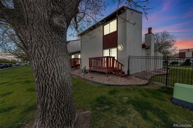 1236 Sequerra St, Broomfield, CO 80020 - rear view of property with stucco siding and a deck