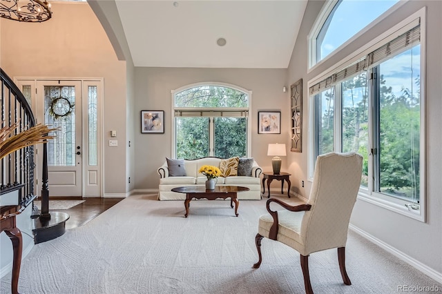 sitting room with a healthy amount of sunlight and vaulted ceiling