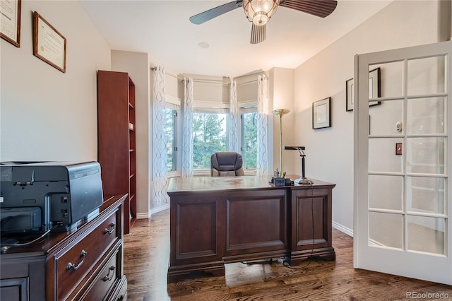 office area featuring ceiling fan and dark wood-type flooring