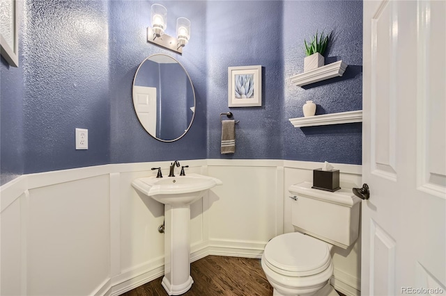 bathroom featuring sink and toilet