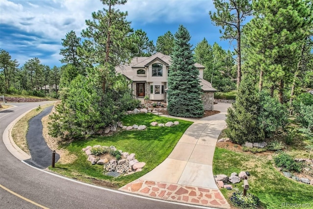 view of front of home with a front lawn