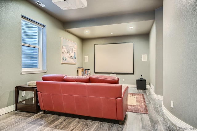 home theater room featuring wood-type flooring