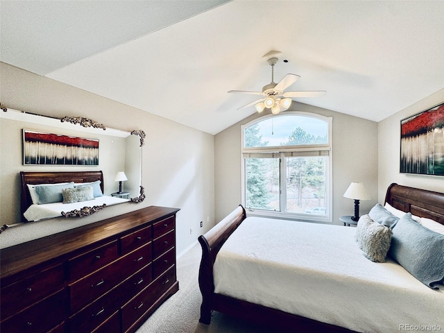 bedroom featuring ceiling fan, carpet, and vaulted ceiling