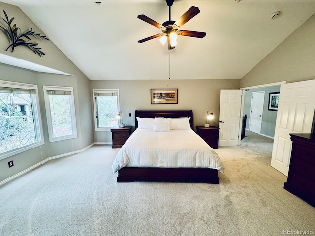 carpeted bedroom featuring ceiling fan and lofted ceiling