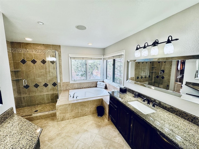 bathroom featuring vanity, tile patterned floors, and separate shower and tub