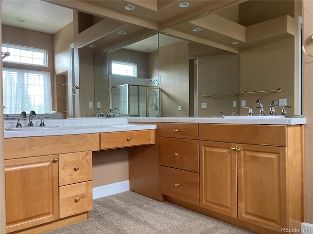 bathroom featuring an enclosed shower and vanity