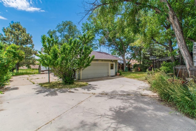 7684 Beverly Blvd, Castle Pines, CO 80108 - view of side of property with an attached garage and driveway