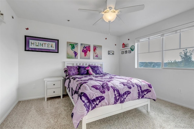 bedroom featuring ceiling fan, baseboards, and carpet floors