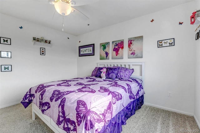 bedroom with ceiling fan, baseboards, and carpet