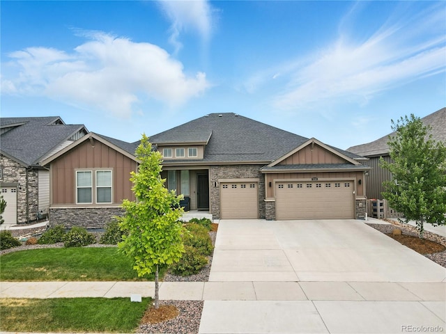 9538 Bear River St, Littleton, CO 80125 - craftsman-style home featuring board and batten siding, an attached garage, stone siding, and concrete driveway