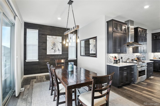 9538 Bear River St, Littleton, CO 80125 - dining space featuring dark wood-style floors, recessed lighting, and an accent wall