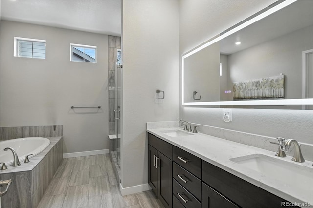 9538 Bear River St, Littleton, CO 80125 - full bath featuring double vanity, a stall shower, and a bath