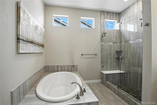 9538 Bear River St, Littleton, CO 80125 - full bath with a bath, a tile shower, and healthy amount of natural light