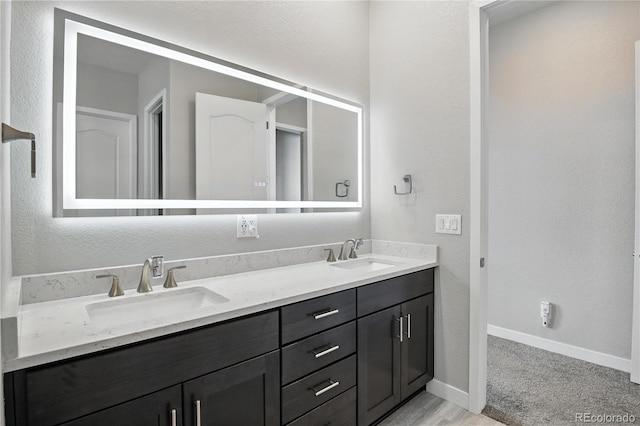 9538 Bear River St, Littleton, CO 80125 - full bath featuring double vanity and baseboards