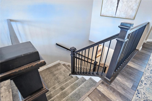 9538 Bear River St, Littleton, CO 80125 - staircase featuring wood finished floors and baseboards