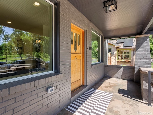 883 S Downing St, Denver, CO 80209 - property entrance with a porch and brick siding