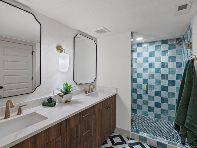 883 S Downing St, Denver, CO 80209 - bathroom featuring double vanity and tiled shower