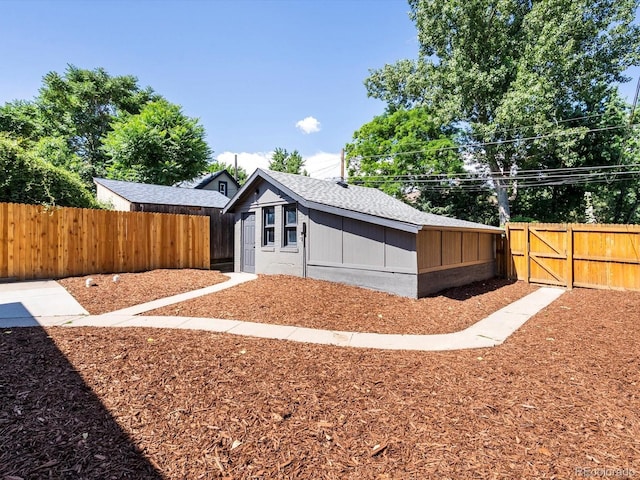 883 S Downing St, Denver, CO 80209 - back of house with a fenced backyard and a gate