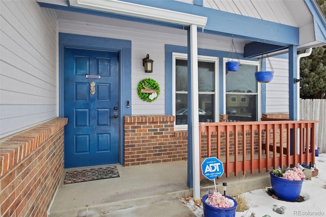 doorway to property with a porch