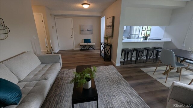 12506 E Cornell Ave Unit 201, Aurora, CO 80014 - living room with wood finished floors and baseboards
